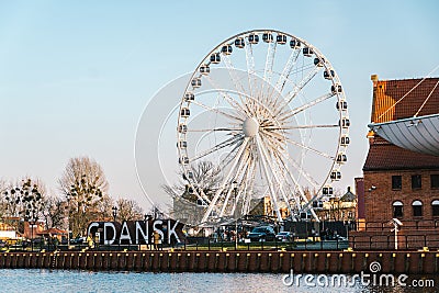 Gdansk, Poland, February. Gdansk giant 3D letters sign with a ferris wheel in the background. Ferris wheel in Gdansk old town. Editorial Stock Photo