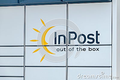 Logo and sign InPost on parcel locker Paczkomat in Poland Editorial Stock Photo