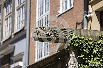 Mariacka street, grotesque gargoyle on front of tenement house, Main city, Gdansk, Poland Editorial Stock Photo