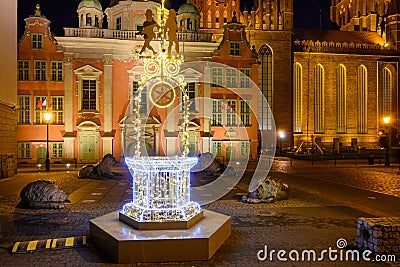 Illuminated fountain in front of the Royal Chapel of St Mary Basilica at the Old Town of Editorial Stock Photo