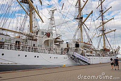 Polish sail training ship Dar Mlodziezy the Gift of Youth in Gdynia port over Baltic Sea Editorial Stock Photo