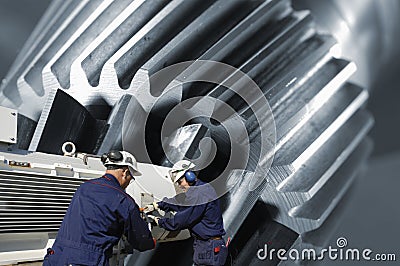 Gear machinery and workers Stock Photo