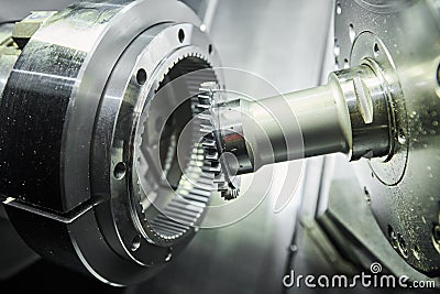 gear skiving operation on cnc machine in metalworking industry. Cutting tool makes internal tooth with mill Stock Photo