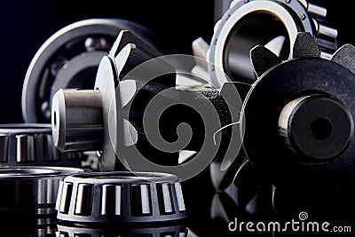 Gears, bearings and differential stars lie on the table close-up Stock Photo