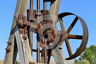 Gears and pulleys of old mining equipment Stock Photo