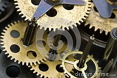Gearwheels inside clock mechanism. Stock Photo