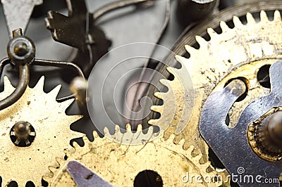 Gearwheels inside clock mechanism. Stock Photo