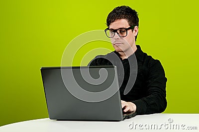Geek working on computer Stock Photo