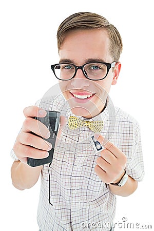 Geeky hipster speaking into dictaphone Stock Photo