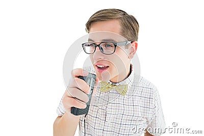 Geeky hipster speaking into dictaphone Stock Photo