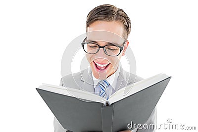 Geeky preacher reading from black bible Stock Photo