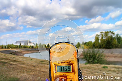 Geiger counter and the Chernobyl nuclear reactor Editorial Stock Photo