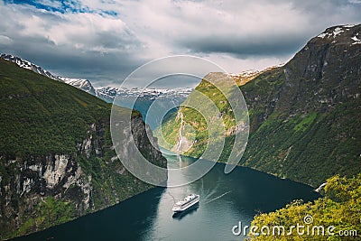 Geirangerfjord, Norway. Touristic Ship Ferry Boat Cruise Ship Liner Floating Near Geiranger In Geirangerfjorden In Stock Photo