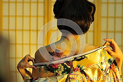 Geisha changing Stock Photo