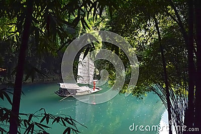 Geisha girl standing on Chinese sail boat Stock Photo