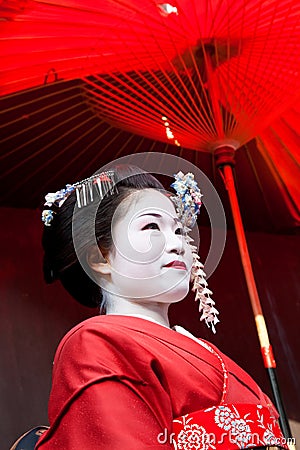 Geisha holding red umbrella, Kyoto, Japan Editorial Stock Photo