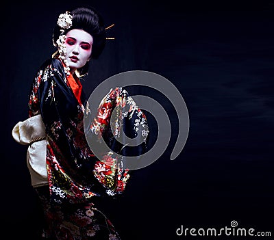 Geisha in kimono on black Stock Photo