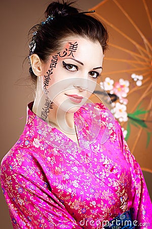Geisha with umbrella Stock Photo