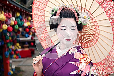 Geisha and umbrella Stock Photo