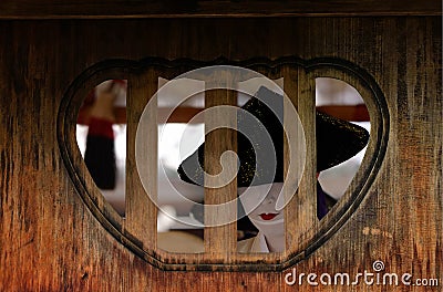 Geisha woman behind an old wooden pane, Kyoto Japan Editorial Stock Photo