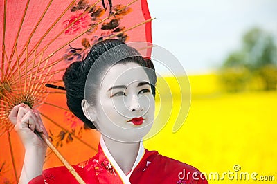 Geisha in the yellow field Stock Photo