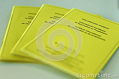 Yellow international vaccination certificate in Austria Editorial Stock Photo