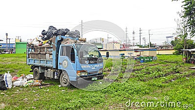Trash-filled garbage truck Editorial Stock Photo