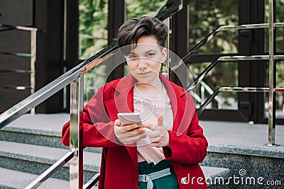 Gen z, social media, influencer, technology, youth millennial people concept. Young brunette girl with short hair using Stock Photo