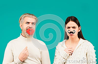 Gender concept. Identity transgender, gender stereotypes. Couple of woman with moustache and man with red lips. Gender Stock Photo