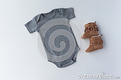 Gender Neutral Grey Baby Bodysuit & Shoes - Unisex Baby Clothing Mockup Stock Photo