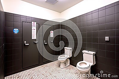 gender-neutral restroom with inclusive signage and accessories, including a toiletries kit Stock Photo