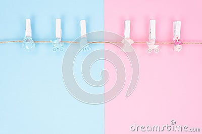 Gender reveal party invitation concept. Background photography of small pegs with carriage toys isolated on divided into two parts Stock Photo