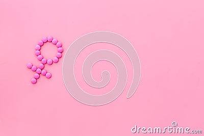 Gender Venus symbol made of contraceptive pills - woman health concept - on pink background top-down copy space Stock Photo