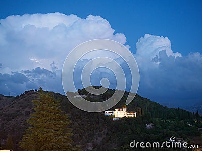 Generalife of Alhamabra in stormy wather with Lightning Stock Photo