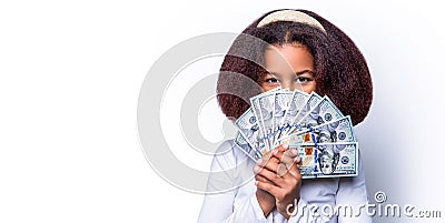 Portrait of a happy young african woman holding bunch of money banknotes isolated over white background. Portrait smile Stock Photo