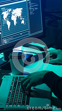 Wanted hackers coding virus ransomware using laptops and computers. Cyber attack, system breaking and malware concept. Stock Photo