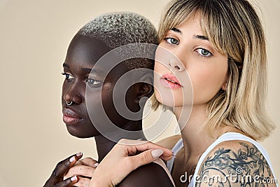 Generation z girls beauty models faces on beige background, close up portrait. Stock Photo