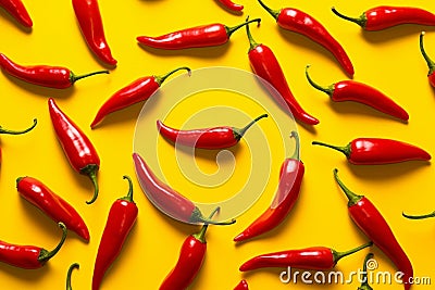Generative AI Word hot made of red spicy Mexican chili pepper of long shape isolated over yellow background Chili Stock Photo