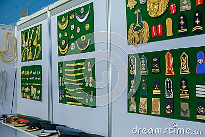 Generic Navy / army uniform badge / accessories at display Editorial Stock Photo