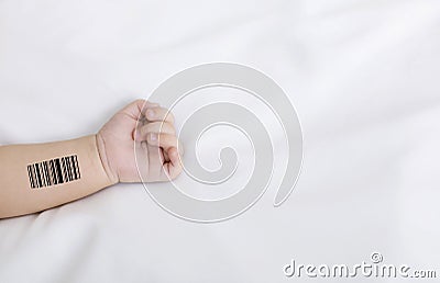 Genetic engineering and cloning. Newborn baby with barcode lying on white sheet, closeup. Collage with copy space Stock Photo