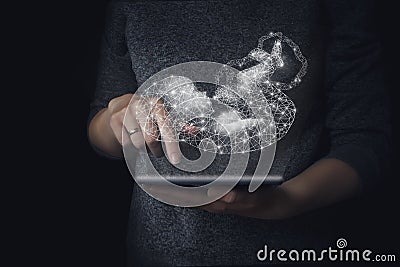 Genetic engineering, surrogacy, embryology. A hologram of a baby in the background of the hand holding a tablet, genetic analysis Stock Photo