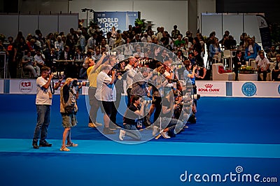 Photographers taking photos of dogs during World dog show. Geneva, Switzerland Editorial Stock Photo