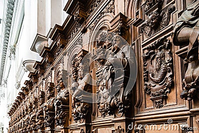 Genial wooden engraved silhouettes and faces in old Abbey Floreffe Editorial Stock Photo