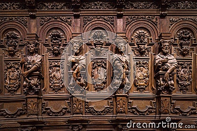 Genial wooden engraved silhouettes and faces in old Abbey Floreffe Stock Photo