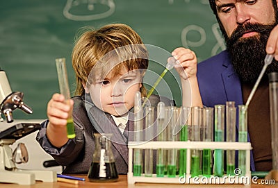 Genius kid. Joys and challenges raising gifted child. Teacher child test tubes. Chemical experiment. Genius minds. Signs Stock Photo