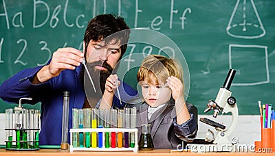 Genius kid. Teacher child test tubes. Chemical experiment. Achieving developmental milestones way before predicted sign Stock Photo