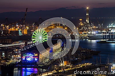 Aerial view of Genoa, Italy at night, the harbor with the Lanterna, the lighthouse, symbol of Editorial Stock Photo