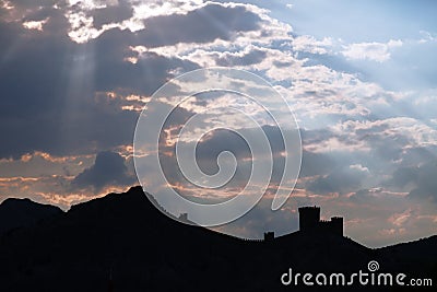Genoese fortress silhouette with blue sky and clouds Stock Photo