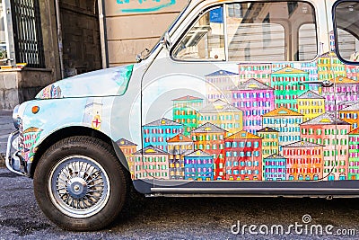 Genova, Italy - vintage Fiat 500 car painted with traditional cityscape of Liguria Region - Italy travel destination Editorial Stock Photo