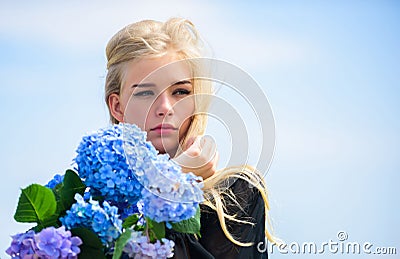 Gentle flower for delicate woman. Pure beauty. Tenderness of young skin. Springtime bloom. Girl tender blonde hold Stock Photo